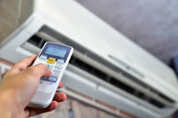 HVAC technician diagnosing airflow and cooling performance with professional testing tools