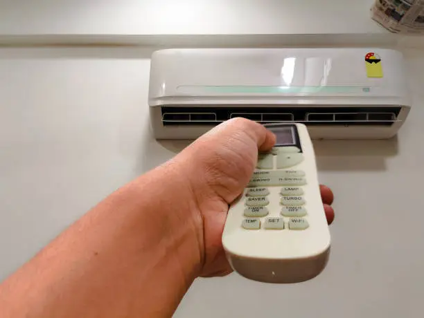 HVAC professional testing thermostat accuracy and airflow for optimized cooling performance
