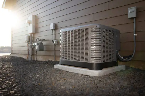 HVAC technician diagnosing rooftop unit airflow issue at busy Hempstead storefront