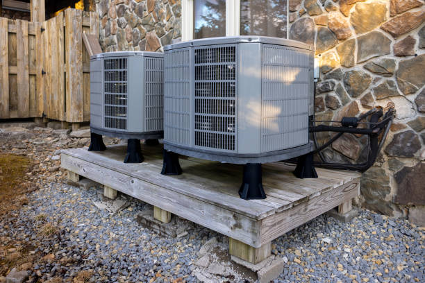 Technician testing air circulation in multi-room Great Neck retail and office property