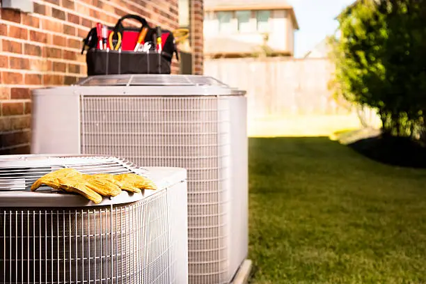 Technician restoring cooling in busy Nassau County storefront during afternoon customer hours
